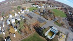 This is shot from the DodgeVille MA. soccer field from about 300' up.  You can see the St. Stephen's cemetary and the plot of rich green grass where St. Stephen's church resided until recently.  