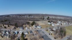 This is shot from the DodgeVille MA. soccer field from about 300' up.  You can see the St. Stephen's cemetary and the plot of rich green grass where St. Stephen's church resided until recently.  